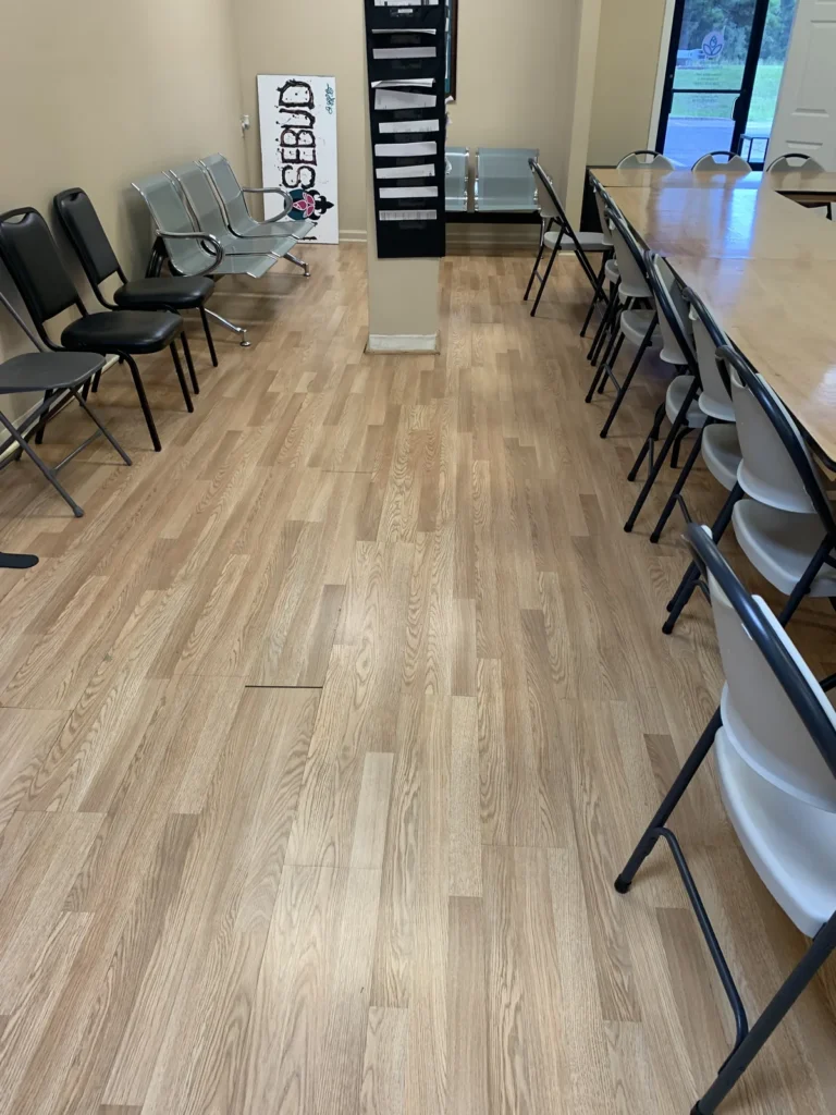 Clean wood-look floor in a waiting area after service by Divine Cleaning and Janitorial